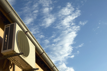 Low angle view of an air conditioner on the side of a building